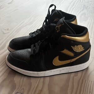 Black & Gold Nike Jordan high top sneakers